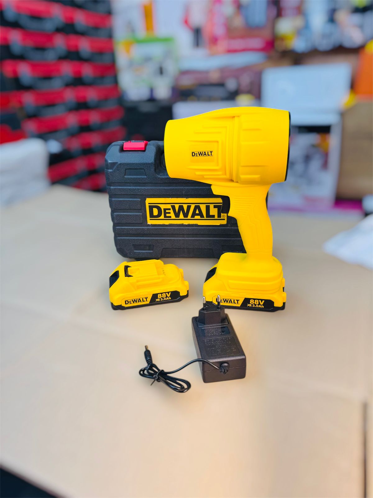 DeWalt power drill set on a table with a blurred background