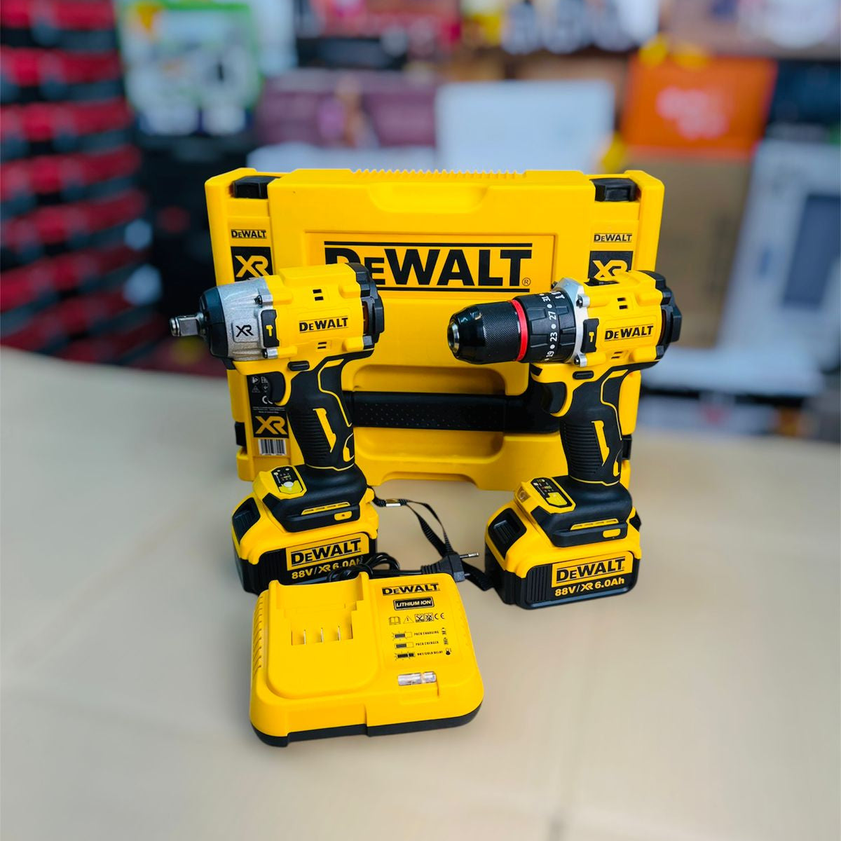 DeWalt power tool set on a counter with a blurred store background