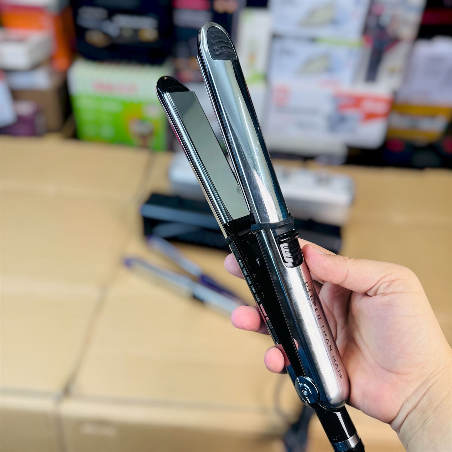 Hair straightener in use