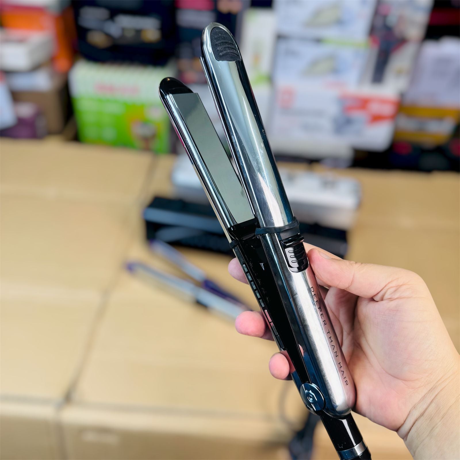 Hair straightener in use